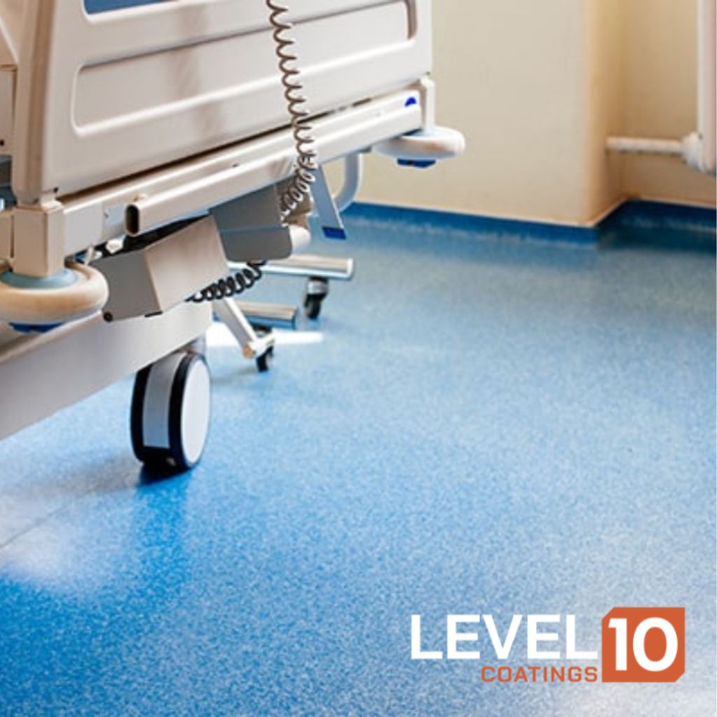 Hospital bed on a stunning blue epoxy floor designed for healthcare settings.