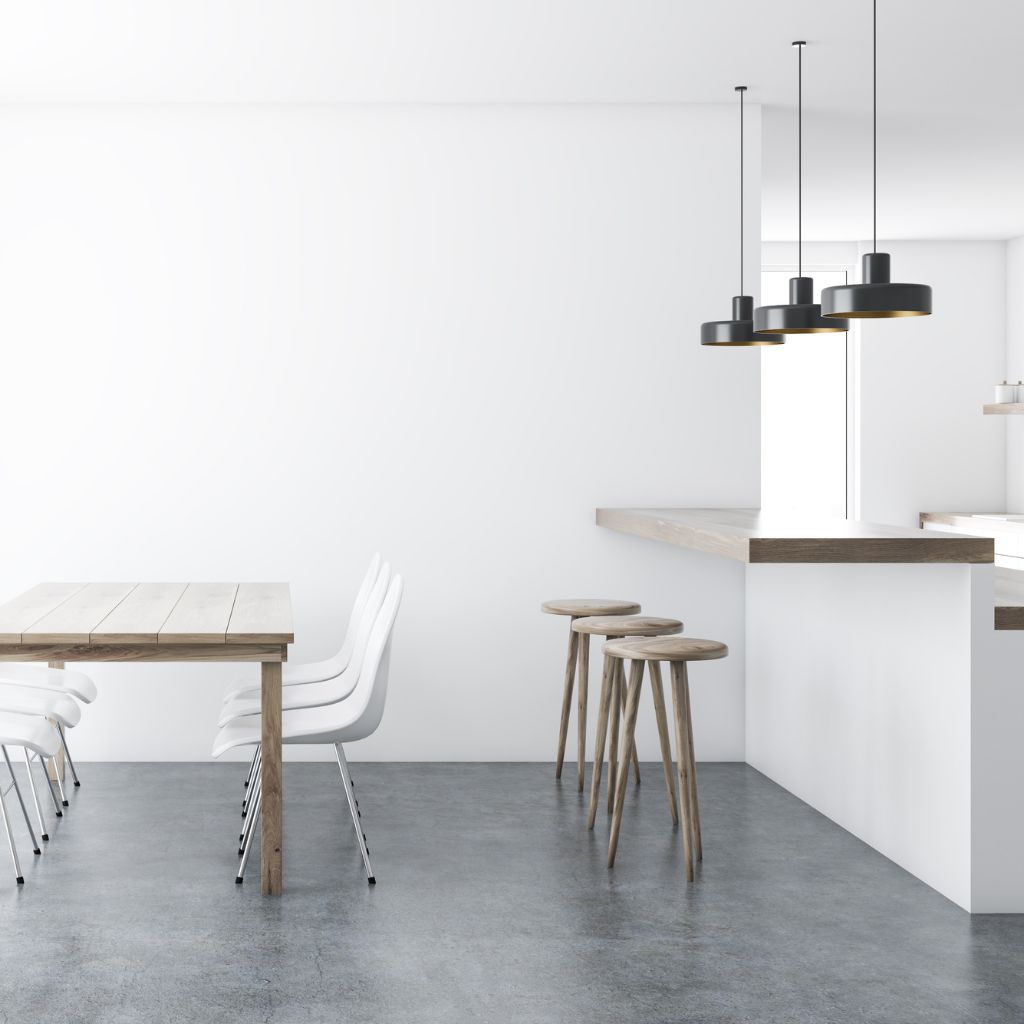 Elegant dining room and kitchen with exquisite epoxied concrete floor.