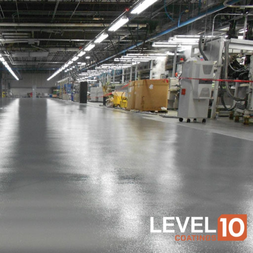 Reflective polished concrete floor enhancing operational efficiency in a production facility.