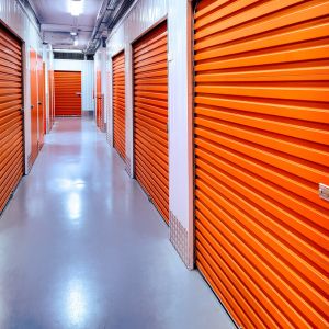 Long hallway with multiple storage units, underscored by our polished concrete flooring.