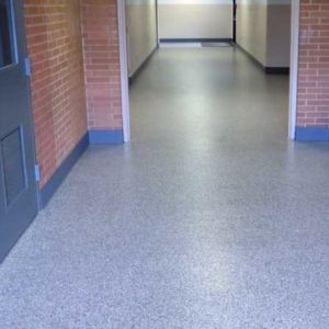 Sleek and sturdy epoxy flooring in a middle school corridor.
