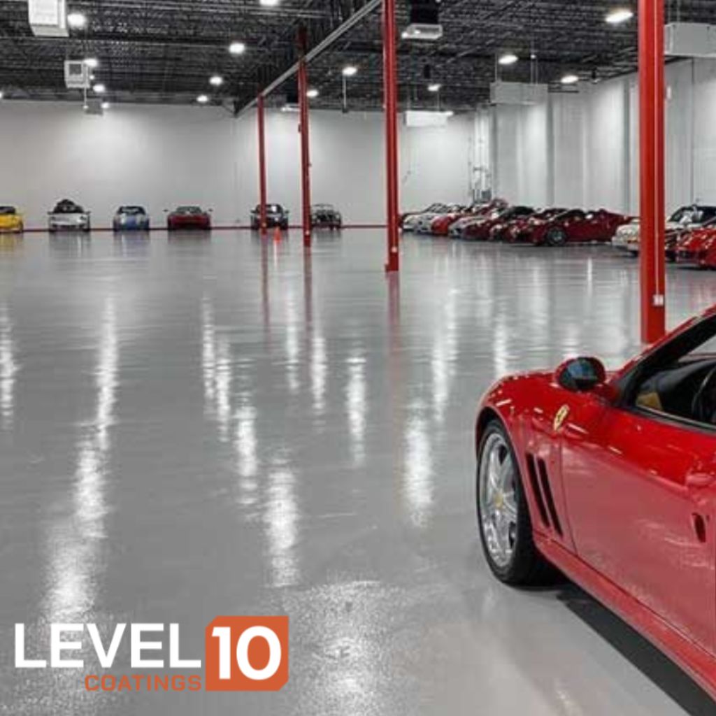 High-gloss epoxied floor in an exotic car showroom offering a pristine setting for showcasing luxury vehicles.