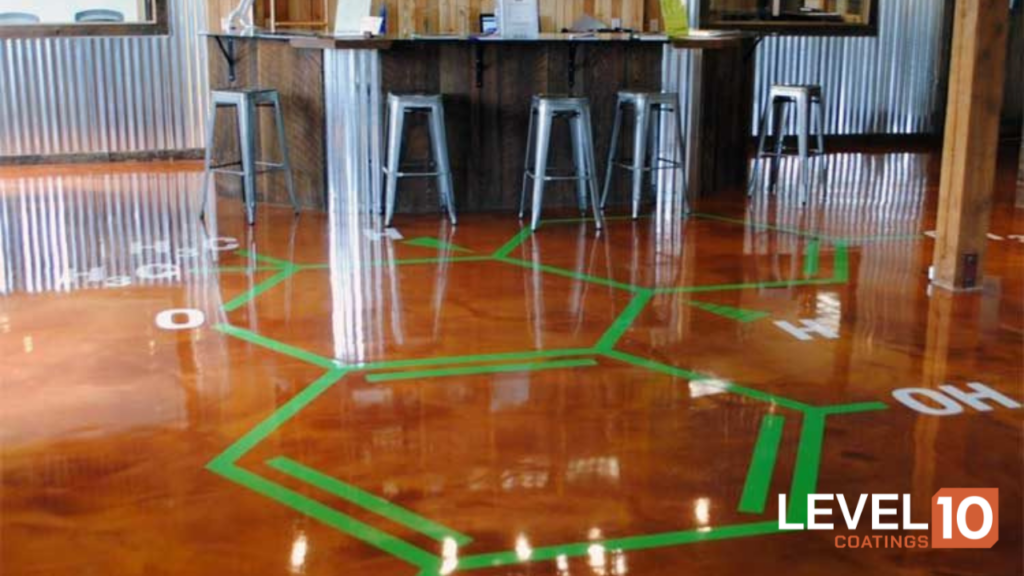 Intricate cannabis molecule design on vibrant red epoxy flooring.