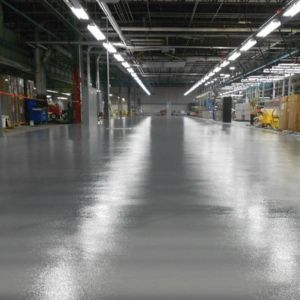 Large warehouse floor finished with epoxy flakes by Level 10 Coatings.