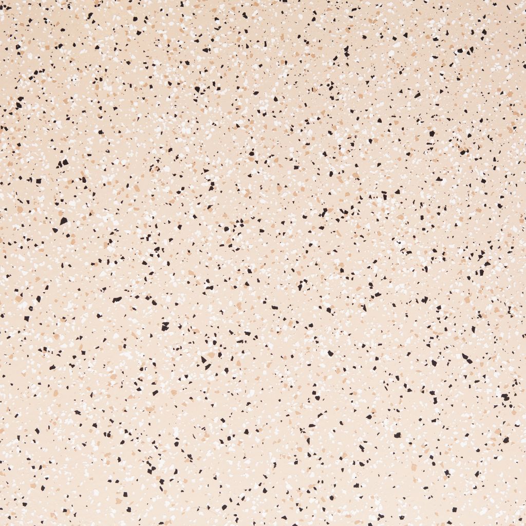 Close-up of beige and black epoxy flake mix for concrete flooring.