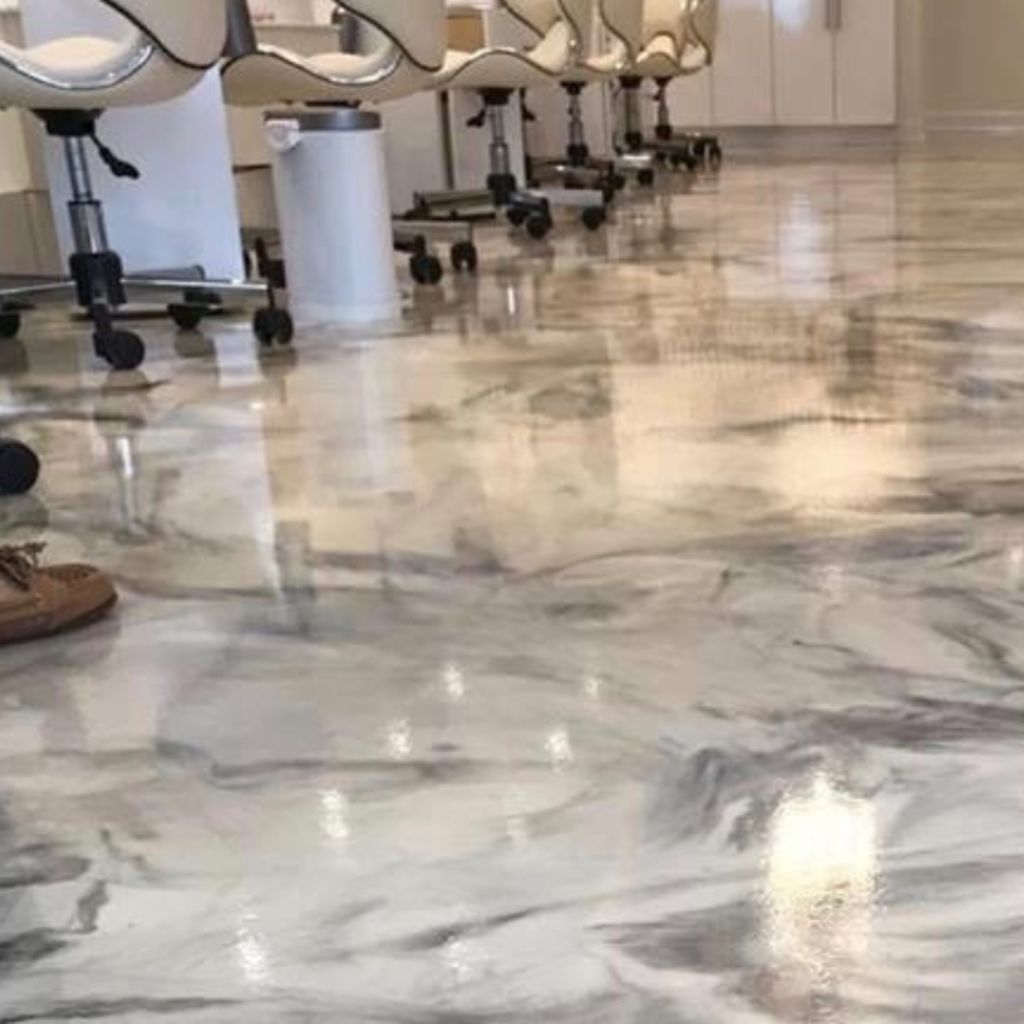 Luxurious white and gray marbled concrete floor in a chic salon.