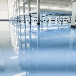 Bright blue solid color concrete floor in a modern setting.